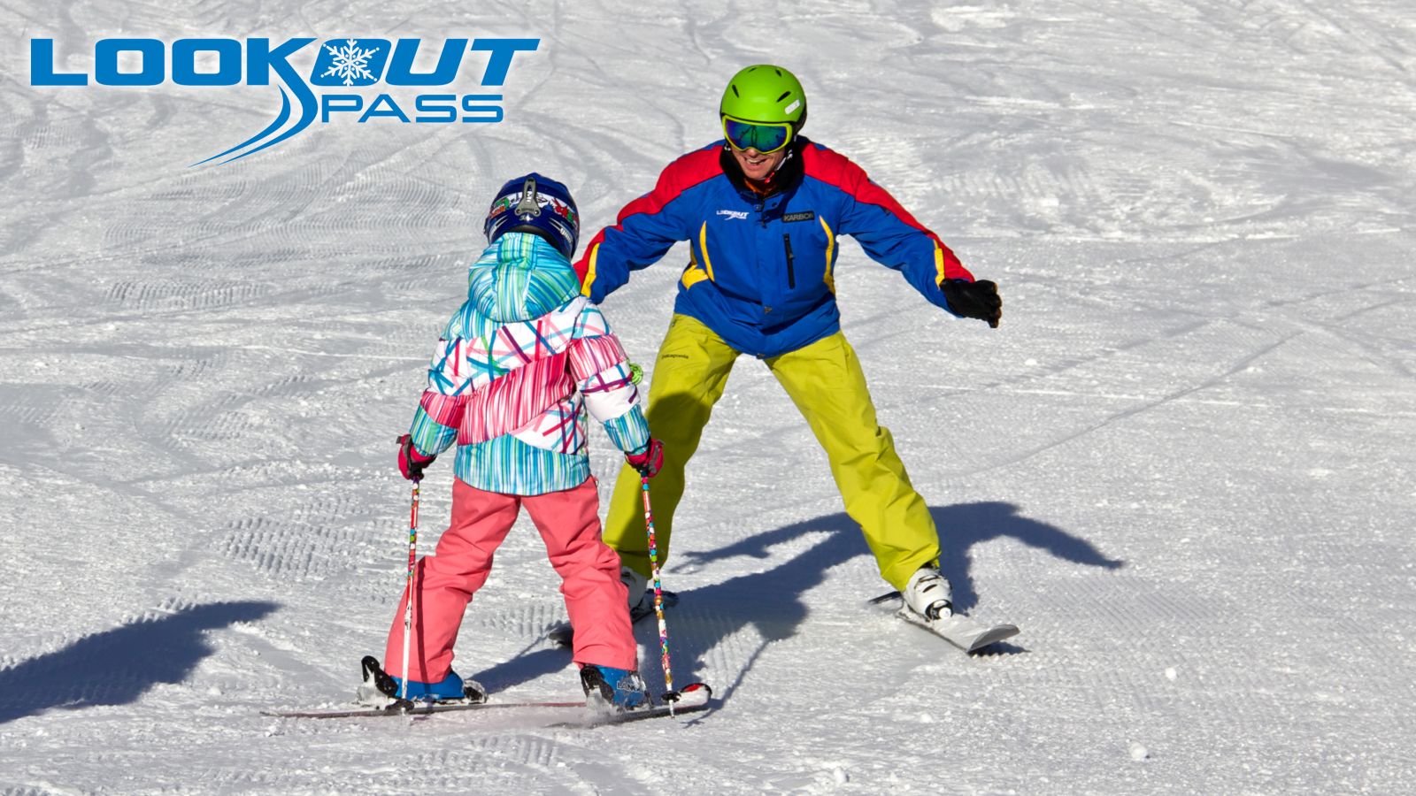 Instructor teaching girl how to ski at Lookout Pass